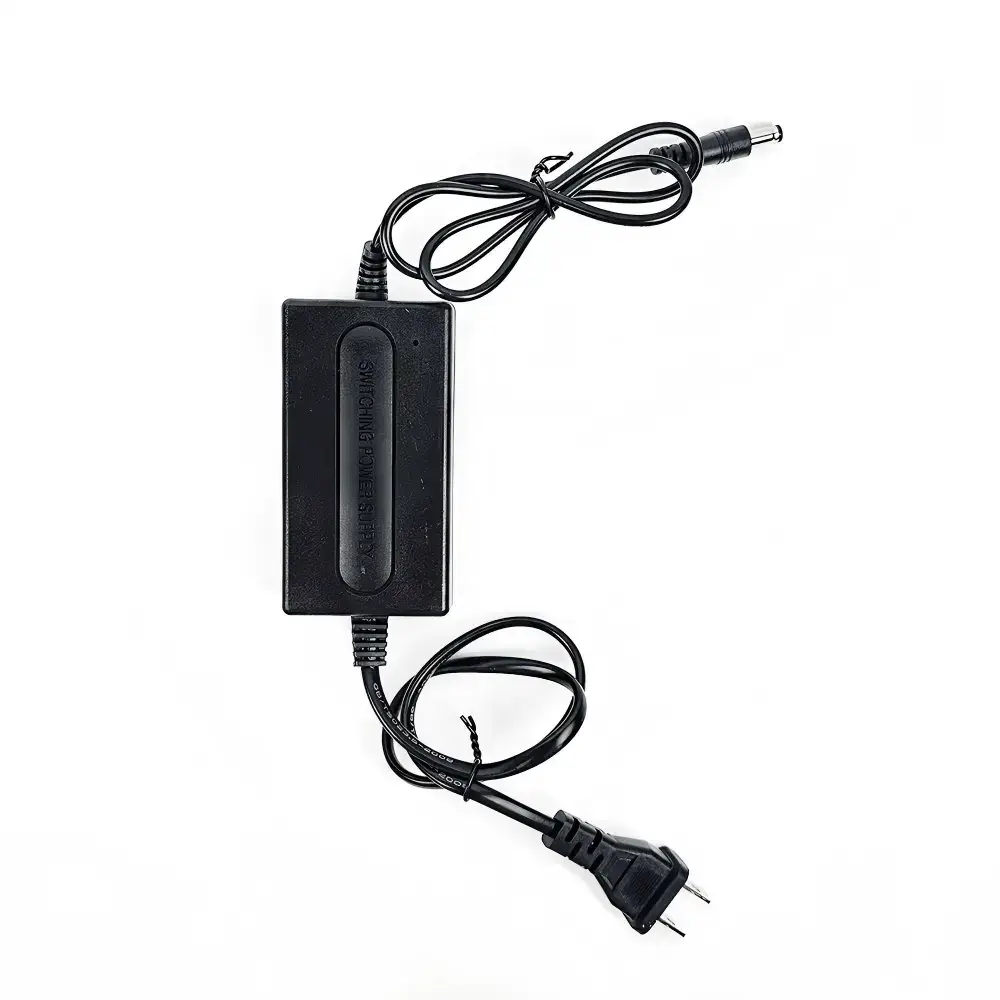 Compact black 12V switching power adapter with input and output cables