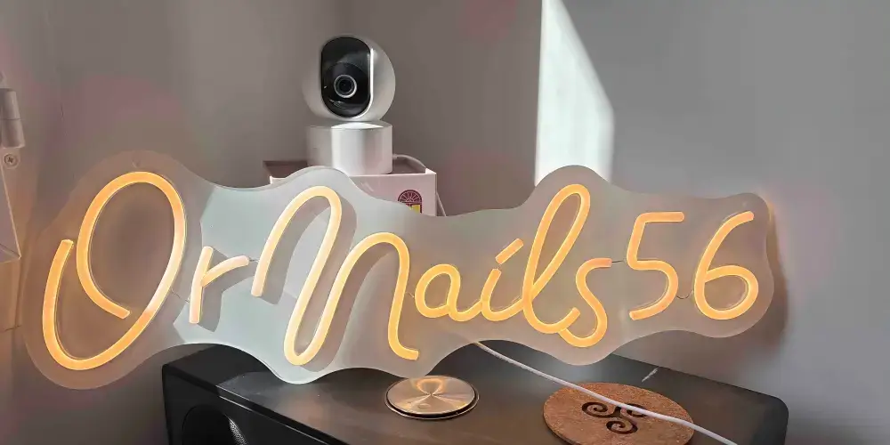 Warm-white OrNails56 custom LED neon sign on clear acrylic