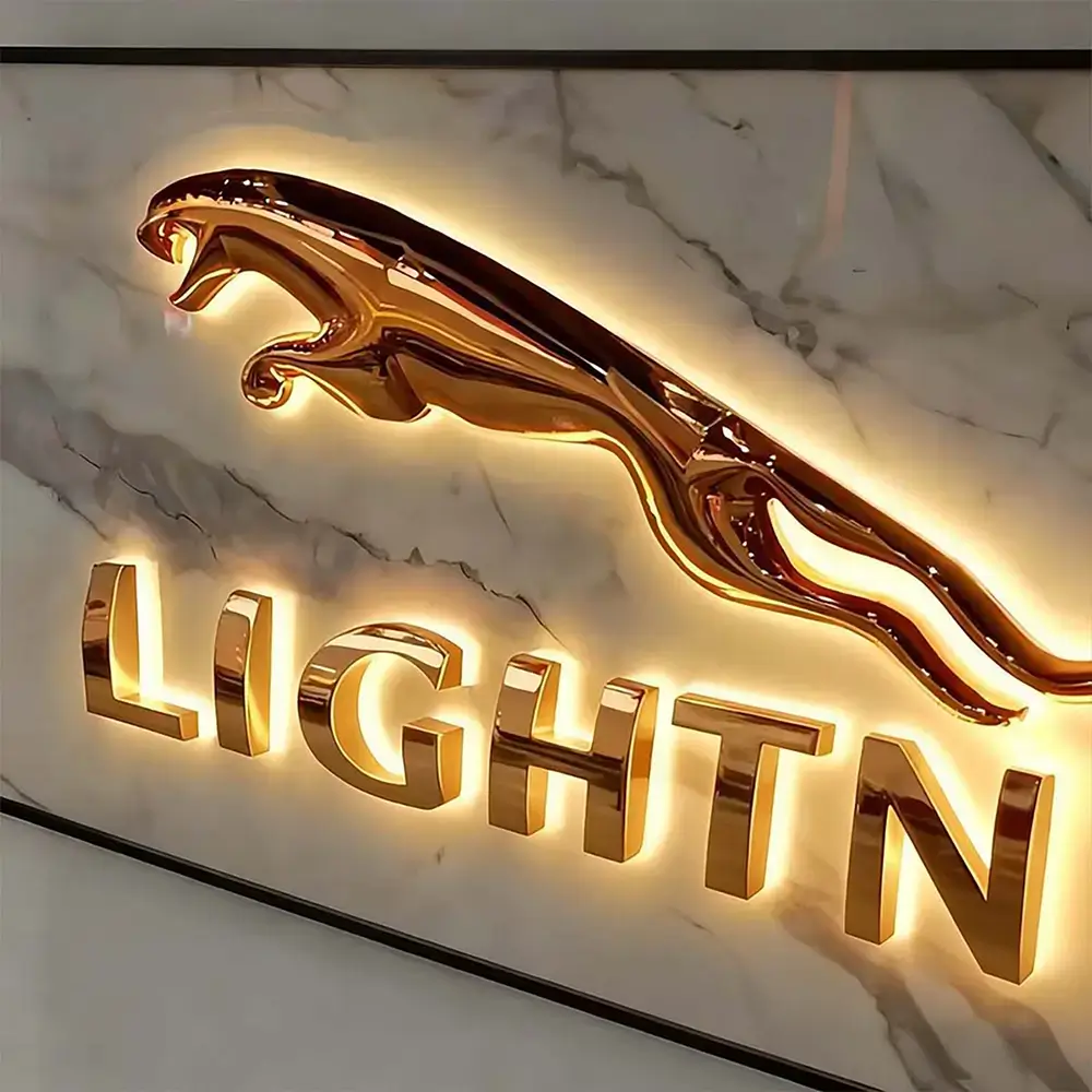 Gold 3D embossed metal logo and letters with warm backlighting