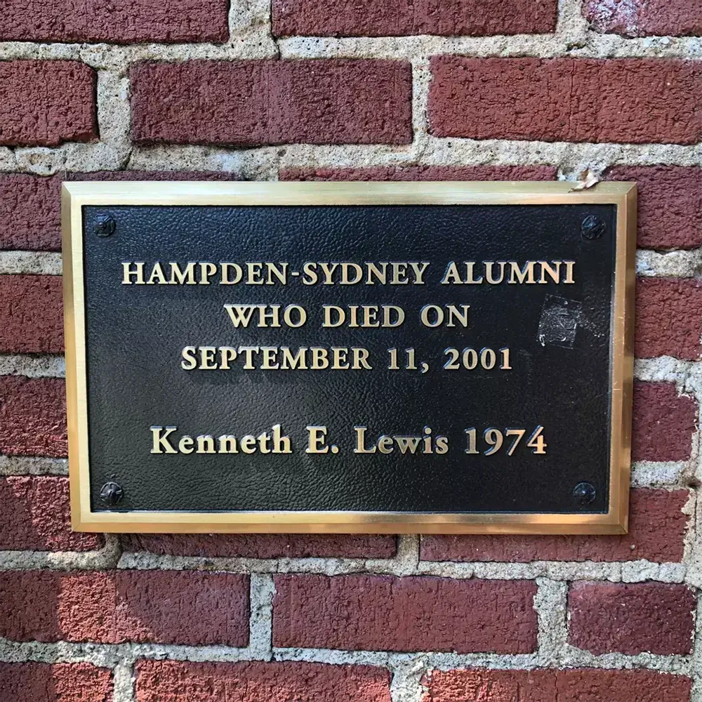 Bronze memorial plaque on brick wall honoring Hampden-Sydney alumni