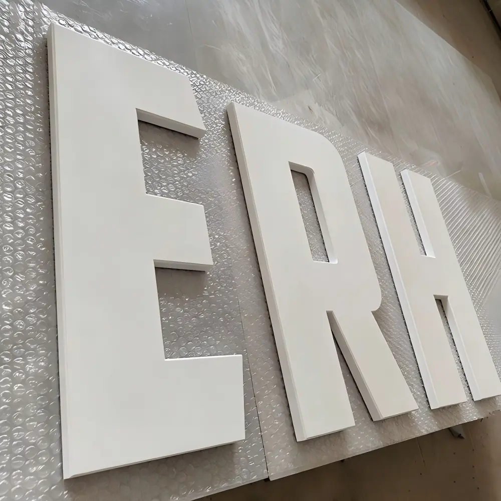 White dimensional letters E R H laid on bubble wrap packaging material