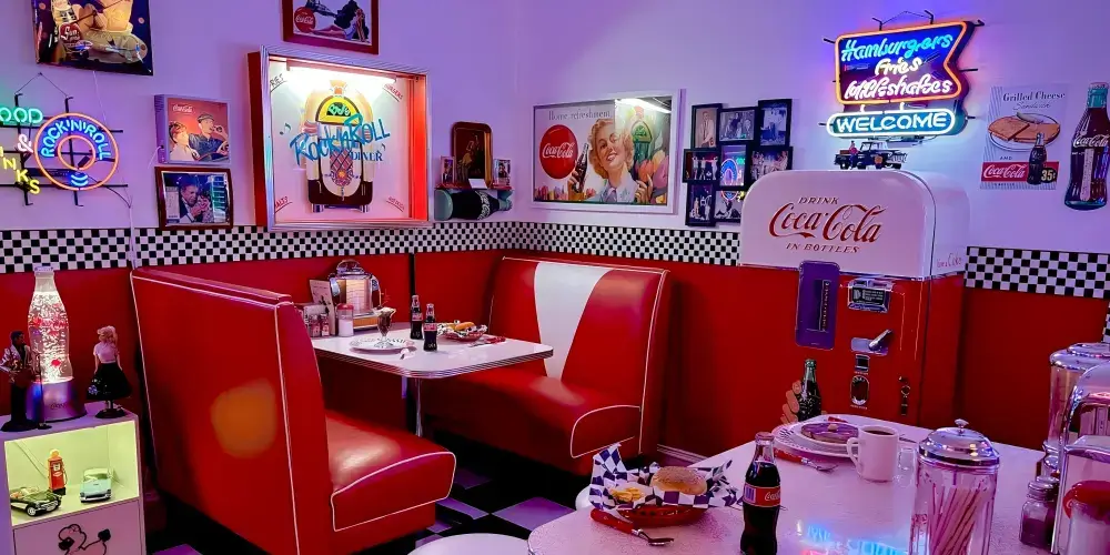 Vintage American diner interior decorated with colorful glass neon signs