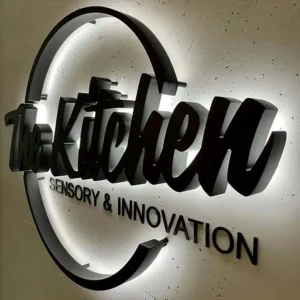 Black acrylic backlit letters and logo with white halo illumination