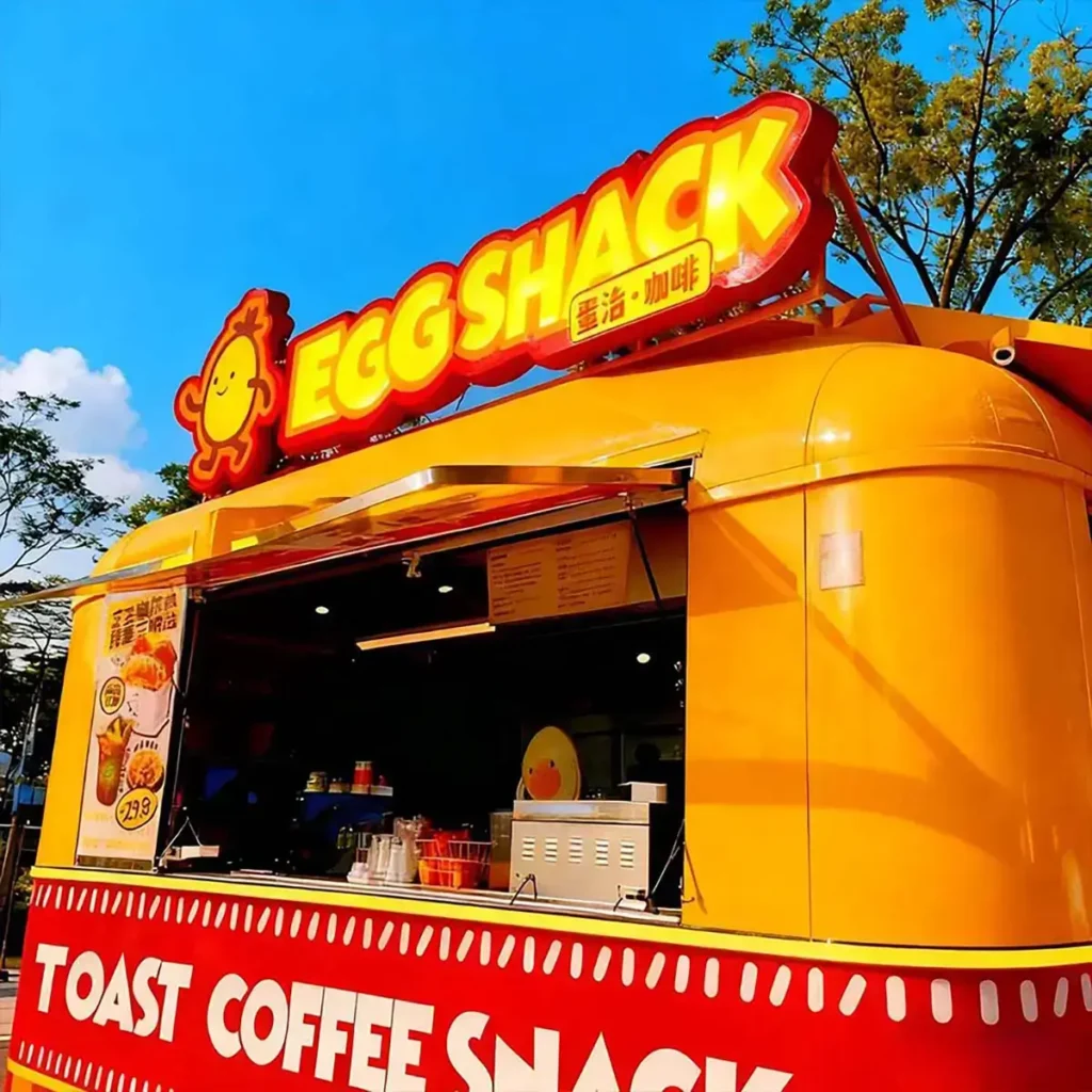 Colorful aluminum trimless acrylic letters installed on an outdoor food kiosk