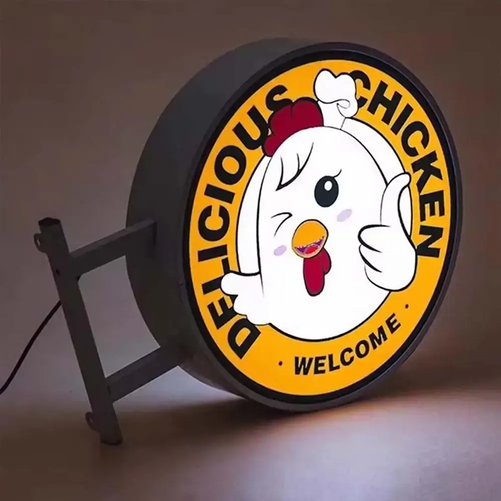 Circular illuminated projecting light box with chicken restaurant graphics