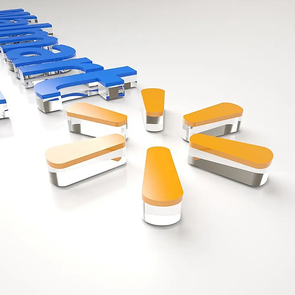 Orange and blue layered acrylic logo components with clear sides on a white background