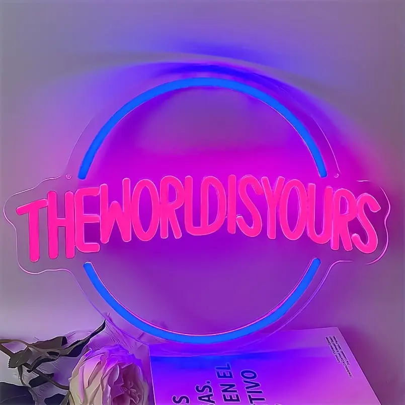 Pink The World Is Yours neon sign with blue circular border