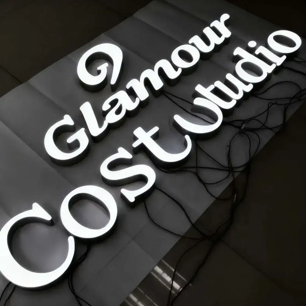 Illuminated channel letters prepared for direct or flush mounting with wiring visible