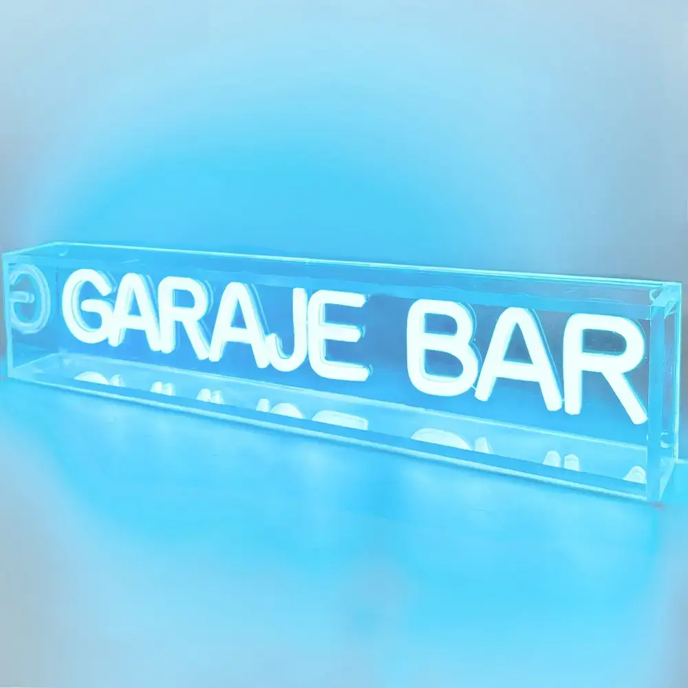 Blue freestanding open-box LED neon sign with illuminated custom lettering