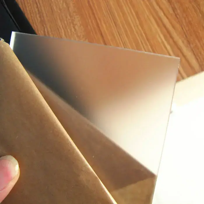 Frosted acrylic sheet with its protective paper partially removed