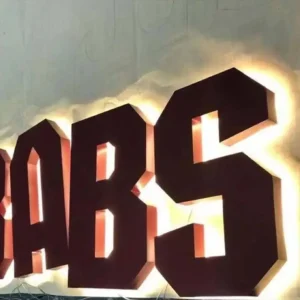 Galvanized steel backlit letters with warm white halo glow