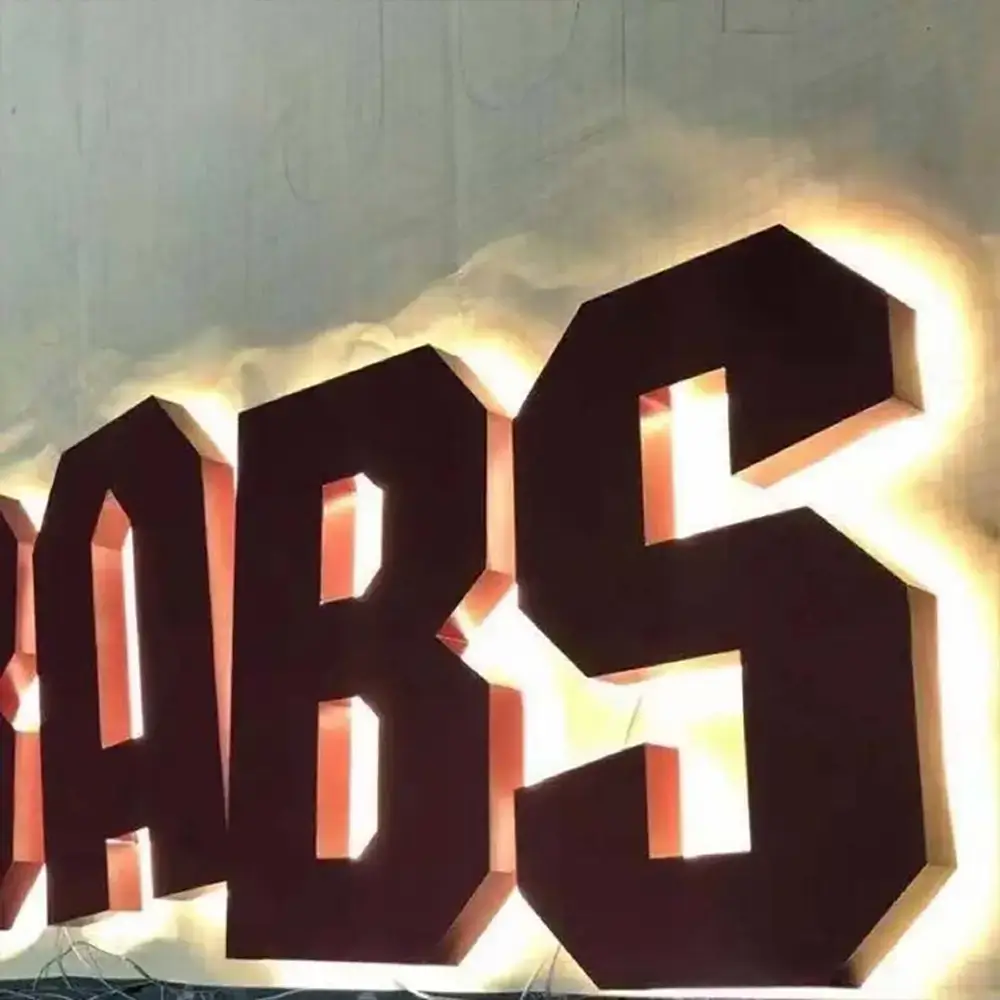 Galvanized steel backlit letters with warm white halo glow