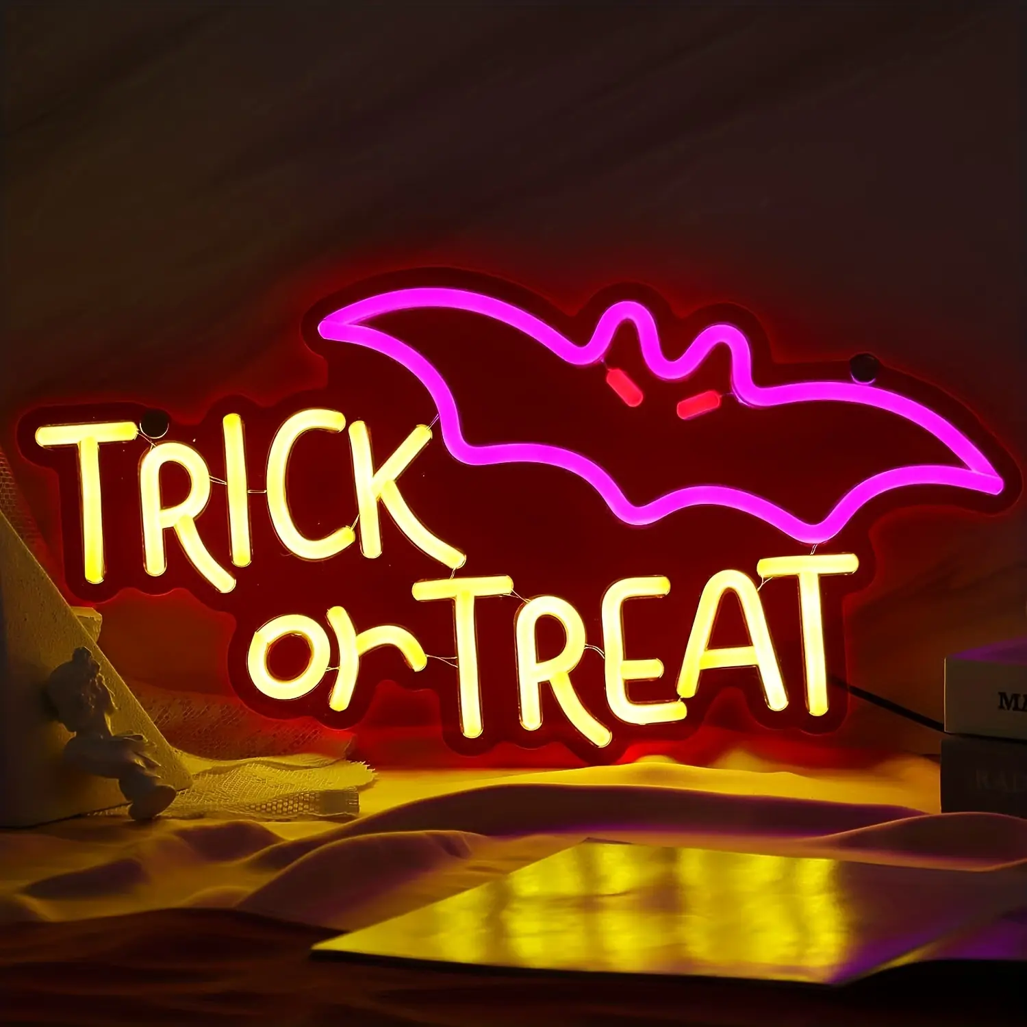 Trick or Treat Halloween neon sign with purple bat