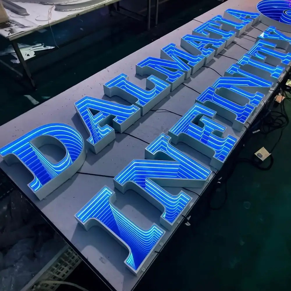 Blue infinity mirror illuminated letters tested in a workshop