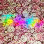 Multicolor The Smiths RGB LED neon sign displayed on a floral wall