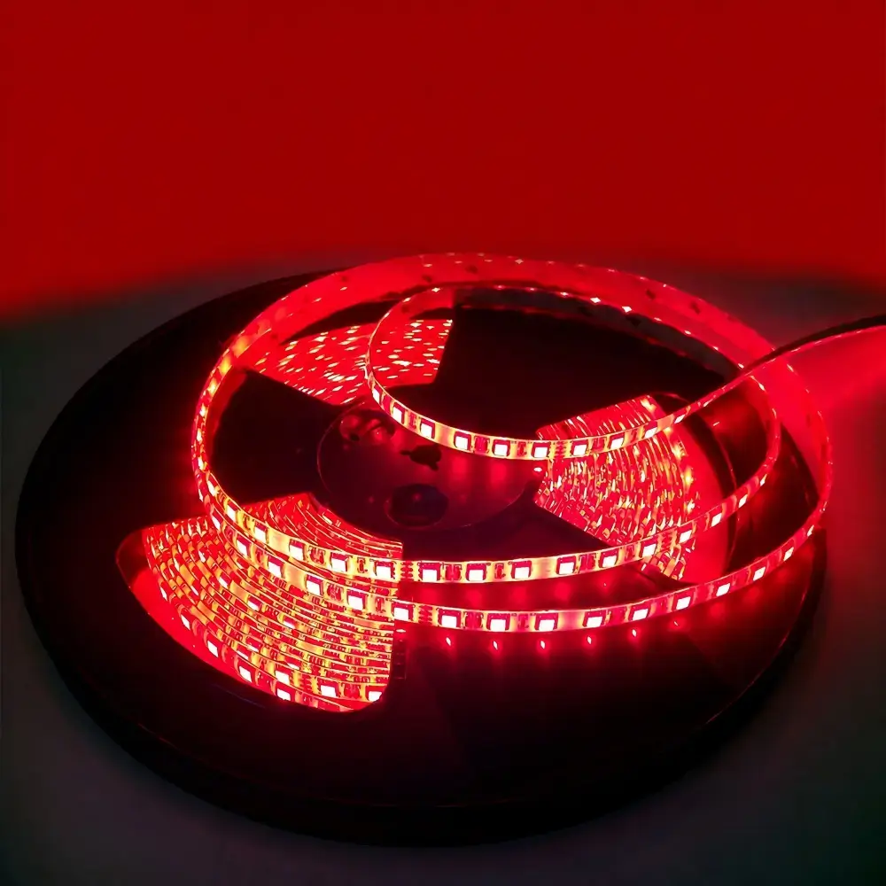 Red LED strip illuminated on a coiled reel