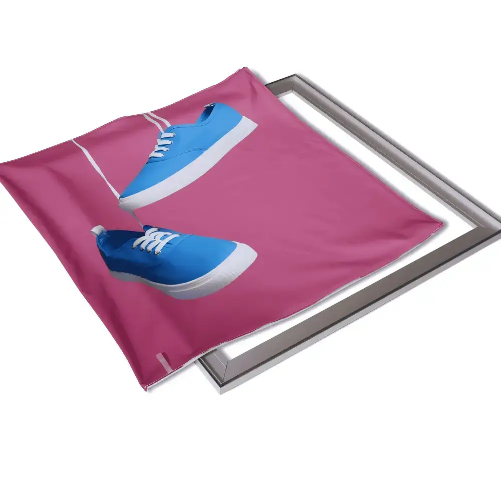 Printed pink SEG fabric graphic with blue shoe artwork beside an aluminum light box frame