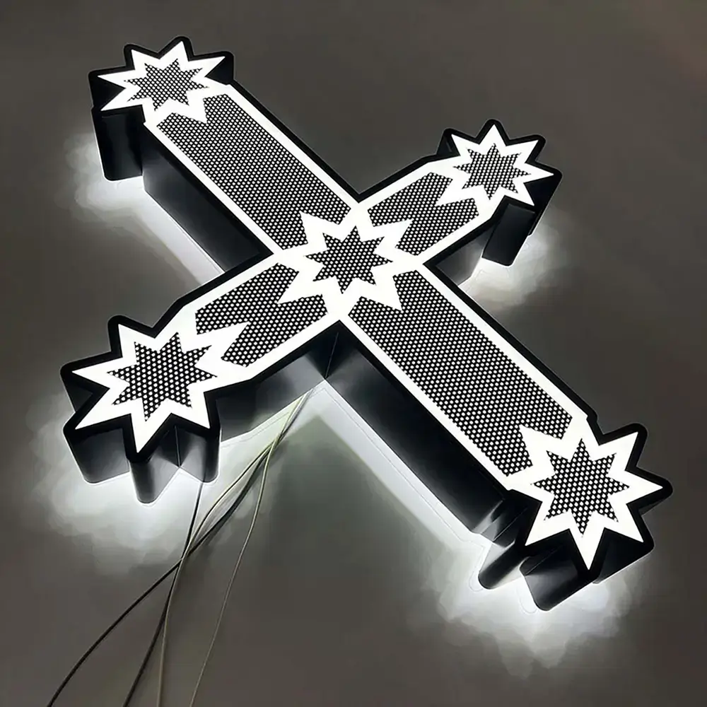 Cross-shaped stainless steel dual-lit logo with white face and halo