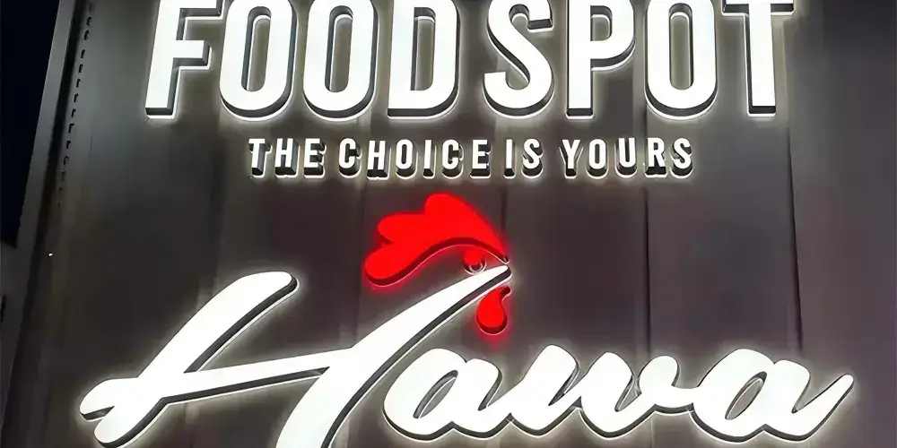 Dual-lit liquid acrylic letters installed on a restaurant feature wall