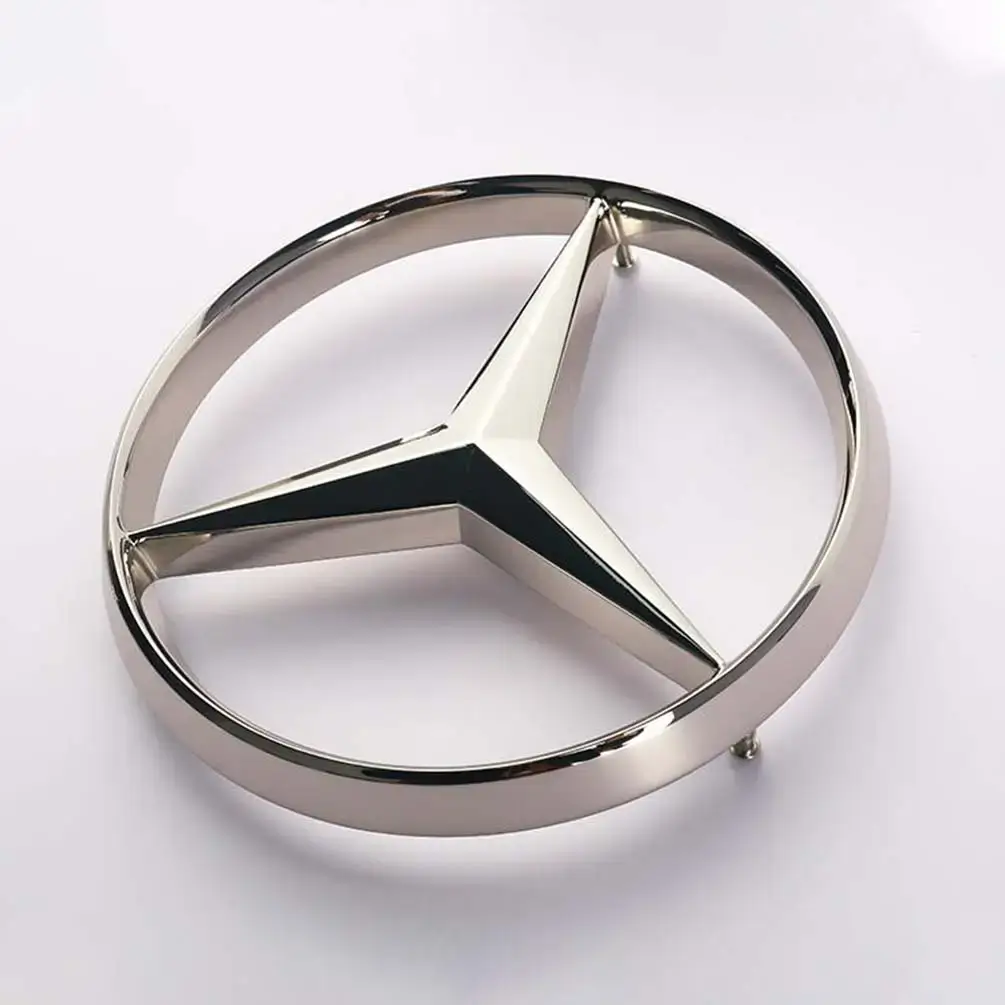 Raised three-pointed star emblem with polished metal finish