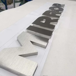 Dimensional metal letters with directional brushed finish